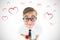 Composite image of geeky hipster holding a red rose