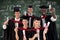 Composite image of group of people graduating from college