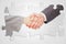 Composite image of handshake between two business people