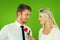 Composite image of handsome man smiling at girlfriend holding a rose