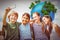 Composite image of happy children taking selfie at park