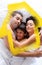 Composite image of happy family lying in bed