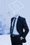 Composite image of headless businessman with hands in pockets