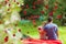 Composite image of loving couple admiring nature while leaning on their cabriolet