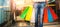 Composite image of low section of man carrying colorful shopping bag