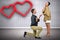 Composite image of man proposing woman while kneeling