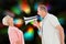 Composite image of man shouting at his partner through megaphone