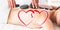 Composite image of a massage session with love hearts