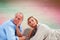 Composite image of mature couple lying and thinking