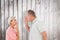 Composite image of older couple holding hands to mouth for silence