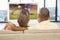 Composite image of over shoulder view of casual couple watching tv