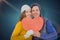 Composite image of portarit of happy couple holding paper heart