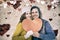 Composite image of portarit of happy couple holding paper heart