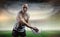 Composite image of portrait of aggressive sportsman playing rugby