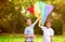 Composite image of portrait of boys with colorful kite
