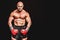 Composite image of portrait full length of bald boxer flexing muscles