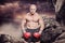 Composite image of portrait full length of bald boxer flexing muscles