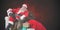 Composite image of portrait of santa sitting on sofa with sack of christmas present beside him