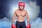 Composite image of portrait of shirtless man with boxing headgear and gloves