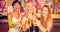 Composite image of portrait of three smiling friend toasting glass of champagne