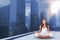 Composite image of pretty brunette doing yoga