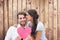 Composite image of pretty brunette giving boyfriend a kiss and her heart