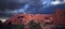 Composite image of a rock formation with window arches in the western desert with eyes peering through