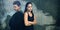 Composite image of sad couple with arms crossed standing back to back