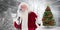 Composite image of santa claus is singing christmas songs