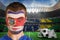 Composite image of serious young costa rica fan with face paint