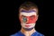 Composite image of serious young costa rica fan with facepaint