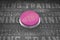 Composite image of shiny pink push button