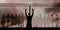 Composite image of silhouette athlete with hands raised