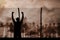 Composite image of silhouette athlete with hands raised