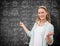 Composite image of teacher explaining maths in blackboard