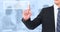 Composite image of unsmiling businessman pointing his finger