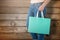 Composite image of women holding shopping bag