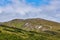 composite landscape. fence near the cross road on hillside meadow in mountains