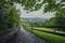 composite landscape. fence near the cross road on hillside meadow in mountains