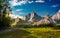 Composite landscape with rocky peaks at sunset