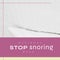 Composite of national stop snoring week text in pink rectangle over white rug in bedroom
