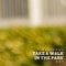 Composite of national take a walk in the park day text over defocused plants growing in park