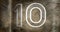 Composite of number 10 against rusty metallic background, copy space