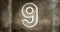 Composite of number 9 against rusty metallic background, copy space