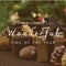 Composite of it\\\'s the most wonderful time of the year text over christmas presents and pinecones