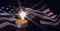 Composition of american flag billowing with lit tea light candle on black