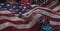 Composition of american flag billowing over red, white and blue fireworks in night sky