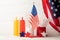 Composition american flag, bottles for sauce and color stars on wooden background