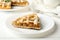 Composition apple pie on white wooden background. Tasty lunch. Homemade breakfast