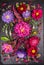 Composition of autumn flowers with asters, dahlias, herbs and leafs on dark table